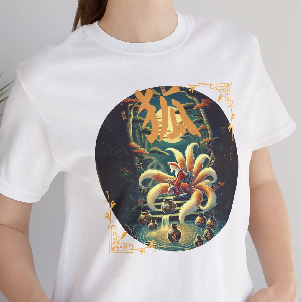 Person wearing a white t-shirt with a colorful graphic design, standing indoors next to a plant.