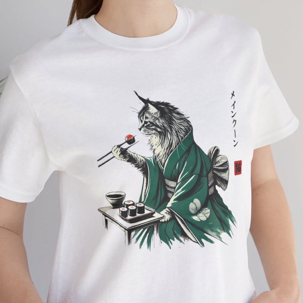 Person wearing a white t-shirt with a graphic design of a cat playing a keyboard.
